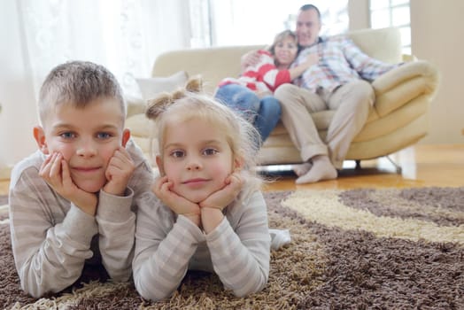 hapy young family have fun  with their children at modern living room home indoors