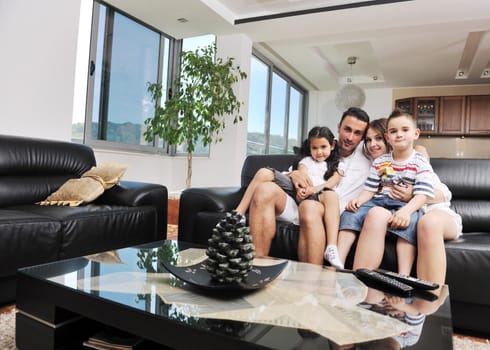 happy young family relax and have fun at modern home indooor