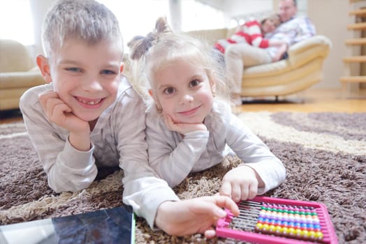 hapy young family have fun  with their children at modern living room home indoors