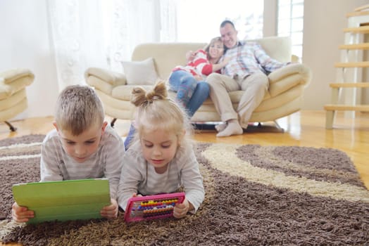 hapy young family have fun  with their children at modern living room home indoors