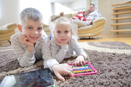 hapy young family have fun  with their children at modern living room home indoors