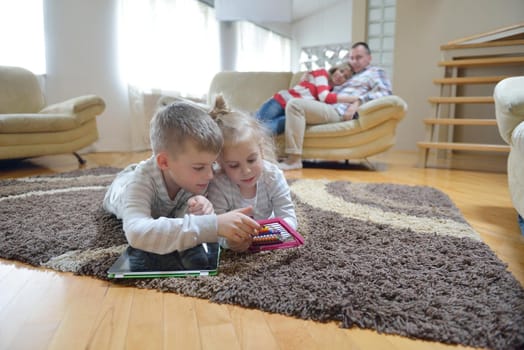 hapy young family have fun  with their children at modern living room home indoors