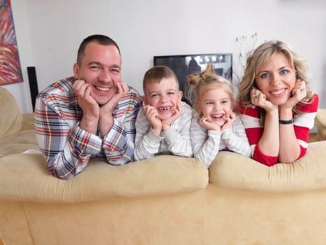 hapy young family have fun  with their children at modern living room home indoors