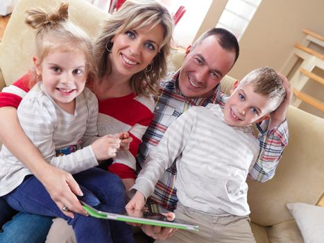 hapy young family have fun  with their children at modern living room home indoors