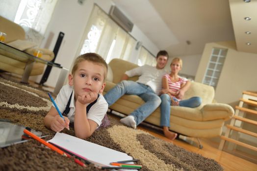 happy young family with kids in bright modern living room have fun and looking big flat lcd tv