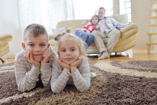 hapy young family have fun  with their children at modern living room home indoors