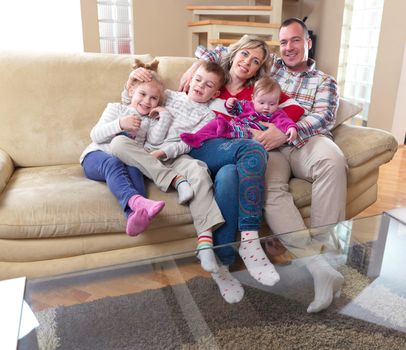 hapy young family have fun  with their children at modern living room home indoors