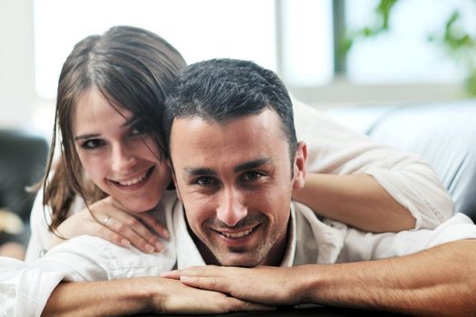 happy young couple relax at modern home livingroom indoor