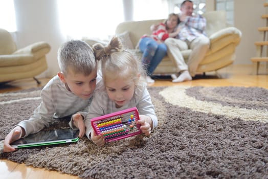 hapy young family have fun  with their children at modern living room home indoors