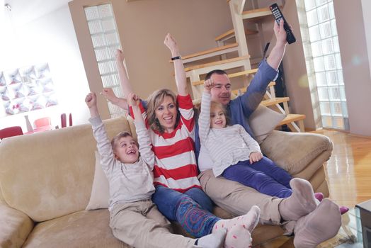 hapy young family have fun  with their children at modern living room home indoors