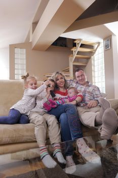 hapy young family have fun  with their children at modern living room home indoors