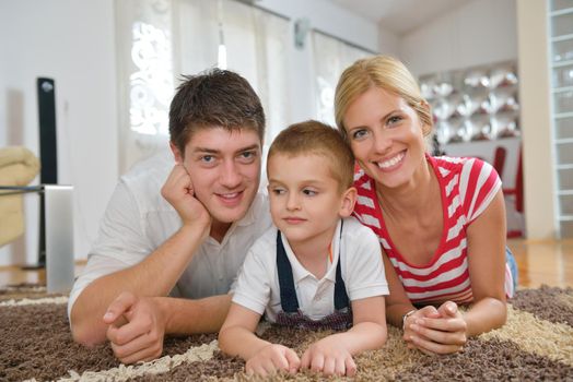 happy young family with kids in bright modern living room have fun and looking big flat lcd tv