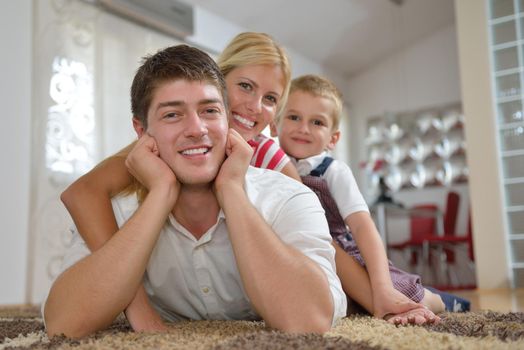 happy young family with kids in bright modern living room have fun and looking big flat lcd tv