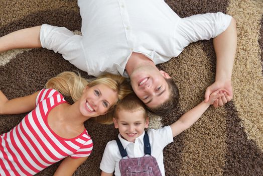 happy young family with kids in bright modern living room have fun and looking big flat lcd tv