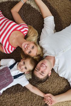 happy young family with kids in bright modern living room have fun and looking big flat lcd tv