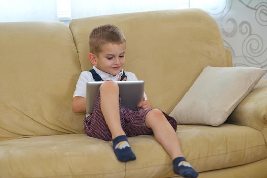 happy young family using tablet computer at modern  home for playing games and education