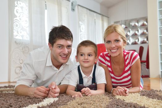 happy young family with kids in bright modern living room have fun and looking big flat lcd tv