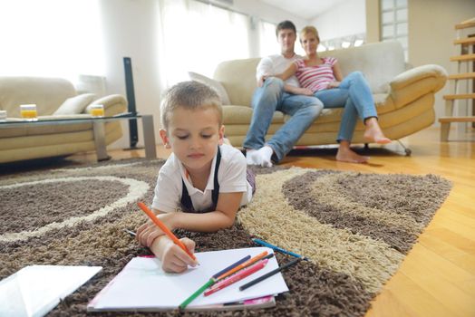 happy young family with kids in bright modern living room have fun and looking big flat lcd tv