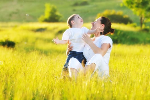 happy young woman mother play and outdoor with beautiful child