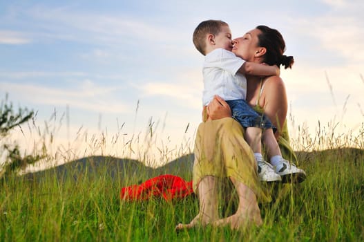 happy young woman mother play and outdoor with beautiful child