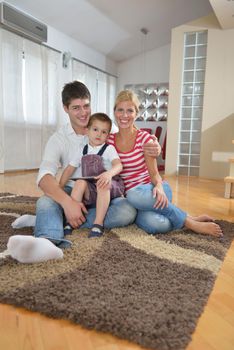 happy young family using tablet computer at modern  home for playing games and education