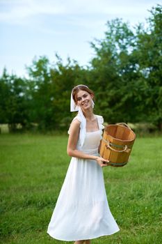 Woman in white dress countryside village nature ecology. High quality photo