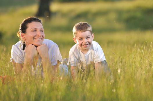 happy young woman mother play and outdoor with beautiful child 