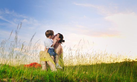 happy young woman mother play and outdoor with beautiful child