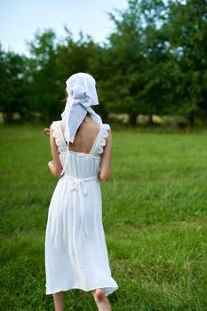 Woman in white dress countryside village nature ecology. High quality photo