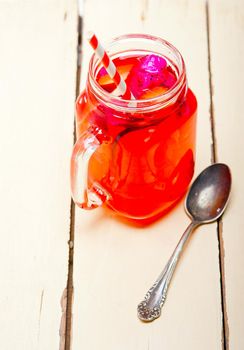 fresh fruit punch refreshing summer  drink over white rustic wood table