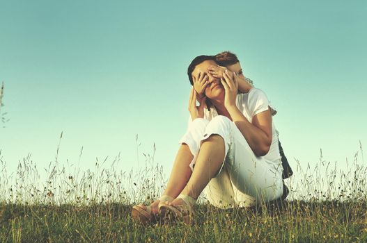 happy young woman mother play and outdoor with beautiful child