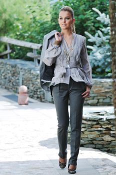 young woman posing in fashionable clothing outdoor