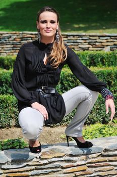 young woman posing in fashionable clothing outdoor