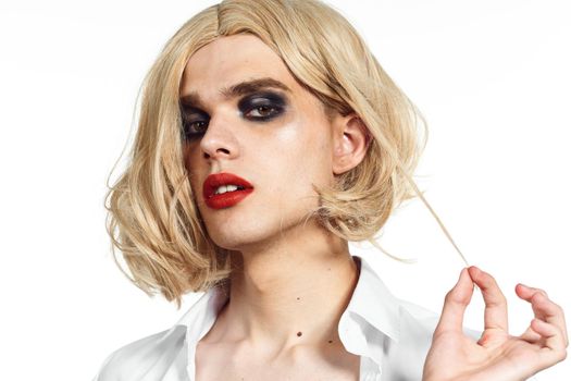 man in women's dress wig makeup posing bisexual. High quality photo