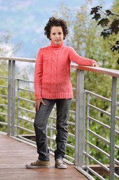 child fashion with beautiful little child outdoor in nature