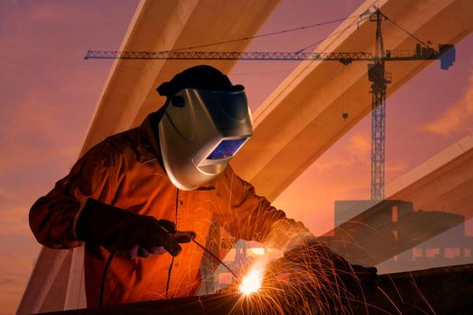 Double exposure of Worker welding steel structure with industrial crane and urban expressway. photo concept for Construction industry and engineering work.