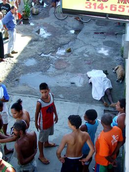 salvador, bahia, brazil - may 25, 2005: Black man is murdered in the street of the city of Salvador.