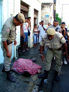 salvador, bahia, brazil - may 25, 2005: Black man is murdered in the street of the city of Salvador.