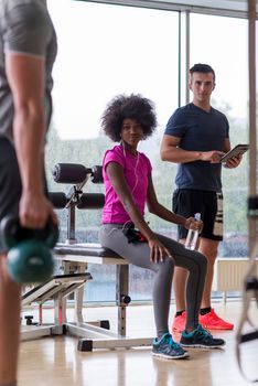 healthy couple have break  at  crossfit gym african  american woman with afro hairstyle