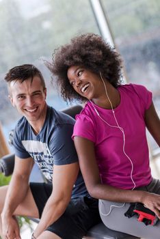 healthy couple have break  at  crossfit gym african  american woman with afro hairstyle