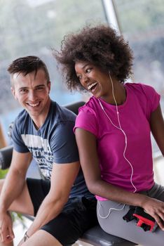 healthy couple have break  at  crossfit gym african  american woman with afro hairstyle