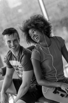 healthy couple have break  at  crossfit gym african  american woman with afro hairstyle