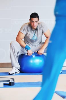 one young healthy man exercice fitness recreation and yoga indoor