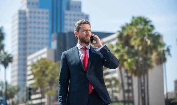 confident man in elegant suit has business negotiation outside, employee.