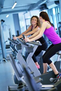 group of young people running on treadmills in modern sport  gym