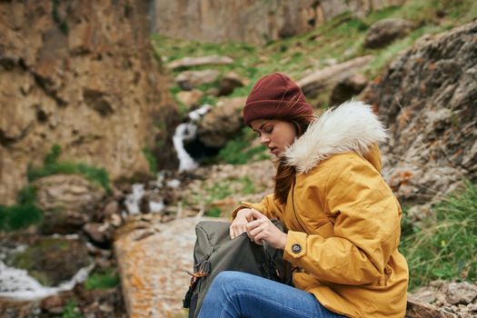 woman hiker with backpack mountains travel adventure freedom. High quality photo