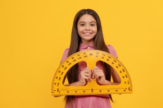 smiling teen girl study math in school hold protractor ruler, angle degree.