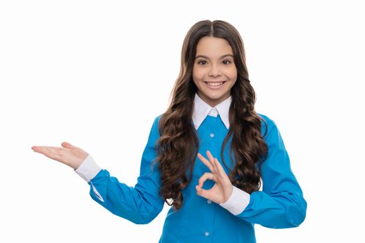 pretty look of young girl. portrait of happy child isolate on white background. express positive emotions. ok. smiling kid with curly hair. beauty and fashion. female fashion model.