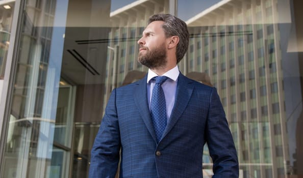 confident bearded businessman in formal suit, businesslike.