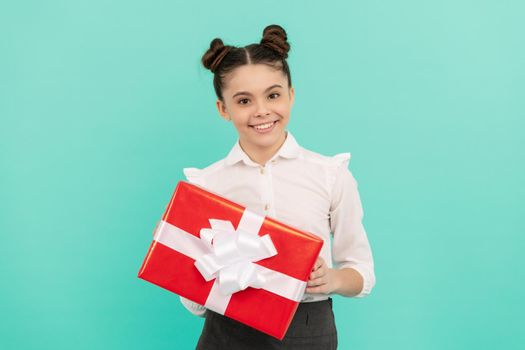 boxing day. present and gifts buy. shopping child with purchase. kid with box. happy birthday holiday. black friday discount. seasonal sales. glad teen girl in school uniform with box.